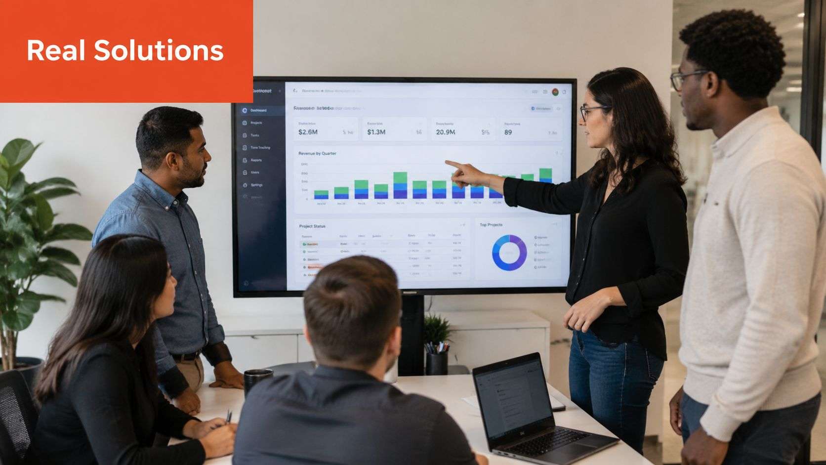 A diverse business team collaborating on a digital project dashboard during an office meeting presentation.